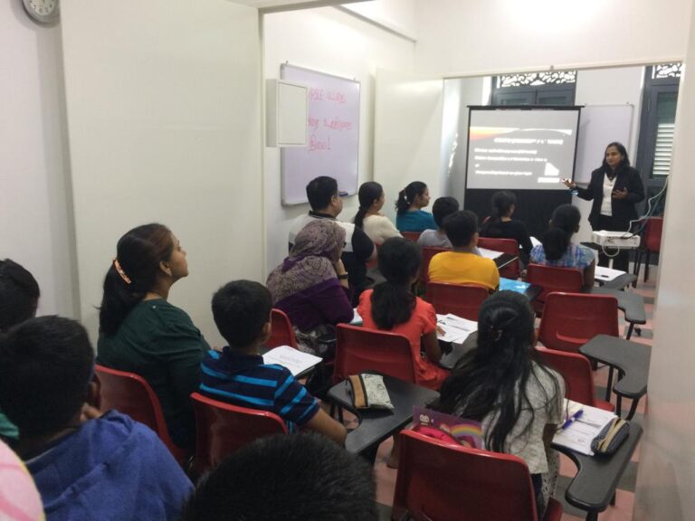 Engaged students learning in a Tamil tuition class at Sigaram - Wordsmith Learning Hub, showcasing an interactive and educational environment.